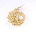 An 18 Karat Yellow Gold and Diamond Brooch