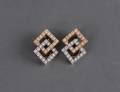 47 PAIR OF FOURTEEN KARAT GOLD AND DIAMOND EAR CLIPS