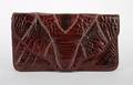 A Red Crocodile Clutch