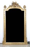 A Neoclassical Carved and Giltwood Mirror
