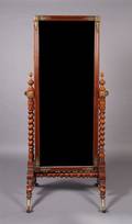 An Empire Style Mahogany and Gilt Metal Mounted Cheval Mirror