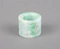 An Apple Green and White Jade Archers Ring