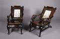 A Pair of Chinese Carved Hardwood Lounge Chairs