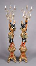 A Pair of Painted and ParcelGilt Blackamoor Torcheres