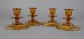 Two Pairs of Amber Glass Candlesticks