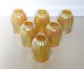 A Set of Six Iridescent Glass Shades