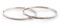 Two 14 Karat White Gold and Diamond Hinged Bangle Bracelets