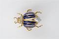 An 18 Karat Yellow Gold Blue Enamel Cultured Pearl Diamond and Garnet Brooch