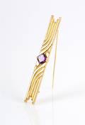 An 18 Karat Yellow Gold and Amethyst Brooch
