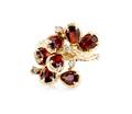 A 14 Karat Yellow Gold Diamond and Garnet Ring