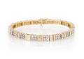 A 14 Karat Yellow Gold and Diamond Line Bracelet