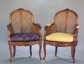 54 PAIR OF LOUIS XV STYLE WALNUT AND CANE BERGERES EN