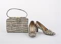 A Black and White Leather Purse with Matching Shoes