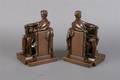 A Pair of Patinated Cast Metal Bookends