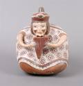 A Precolumbian Terra Cotta Figural Vessel