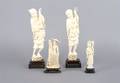 A Group of Three Carved Ivory Figures of a Fisherman