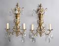 A Pair of Neoclassical Bronze TwoLight Sconces