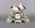 A Continental Rococo Style Porcelain Mantle Clock