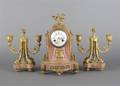 A Louis XVI Style Three Piece Clock Garniture