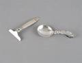 A Danish Sterling Silver Baby Spoon and Food Pusher Georg Jensen