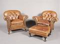 A Pair of English Art Deco Club Chairs and Ottoman