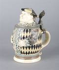 A German Ceramic and Pewter Mounted Character Stein