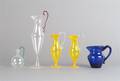 A Collection of Five Glass Pitchers