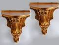 PAIR OF EMPIRE STYLE CARVED AND GILTWOOD BRACKETS