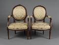 PAIR OF LOUIS XVI STYLE CARVED FRUITWOOD FAUTEUILS