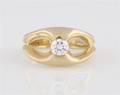 A 14 Karat Yellow Gold and Diamond Ring