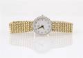 A 14 Karat Yellow Gold and Diamond Wristwatch Baume  Mercier