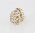 An 18 Karat Yellow Gold and Diamond Ring