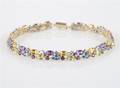 A 14 Karat Yellow Gold and Gemstone Bracelet