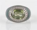 An 18 Karat White Gold Green Enamel Diamond and Peridot Ring