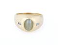 An 18 Karat Yellow Gold Cats Eye Chrysoberyl and Diamond Ring