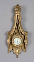 A Louis XVI Style Carved Giltwood Cartel Clock