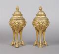 A Pair of Neoclassical Gilt Metal Covered Urns