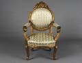 NEOCLASSICAL STYLE CARVED AND GILTWOOD ARM CHAIR