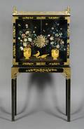 A Chinese Lacquered and Parcel Gilt Chest on Stand
