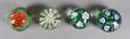 A Collection of Four Floral Paperweights