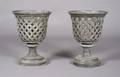A Pair of Cast Metal Urns