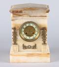 A Gilt Metal Mounted Onyx Mantle Clock
