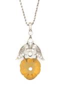 A Platinum Diamond and Carved Citrine Filigree Pendant
