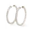 A Pair of 14 Karat White Gold and Diamond Hoop Earrings