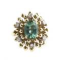 A 14 Karat Yellow Gold Green Tourmaline and Diamond Ring