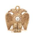 A 14 Karat Rose Gold and Diamond Double Eagle Pendant