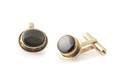 A Pair of 18 Karat Yellow Gold and Black Star Sapphire Cufflinks