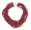 A Twelve Strand Faceted Ruby Bead Torsade Necklace