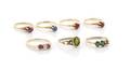 A Group of Yellow Gold Synthetic Ruby Emerald and Blue Sapphire Rings