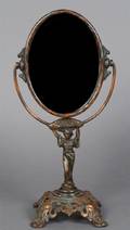 A Cast Metal Figural Mirror Golden MFG